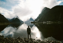 Man looking at lakes and mountains