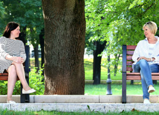 women sitting on a bench