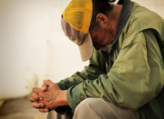 Unemployed man praying
