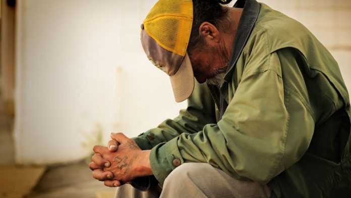 Unemployed man praying