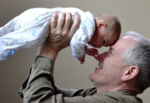Grandfather holding baby