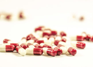 Red and white antibiotic pills