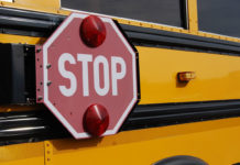 School bus with pop out stop sign