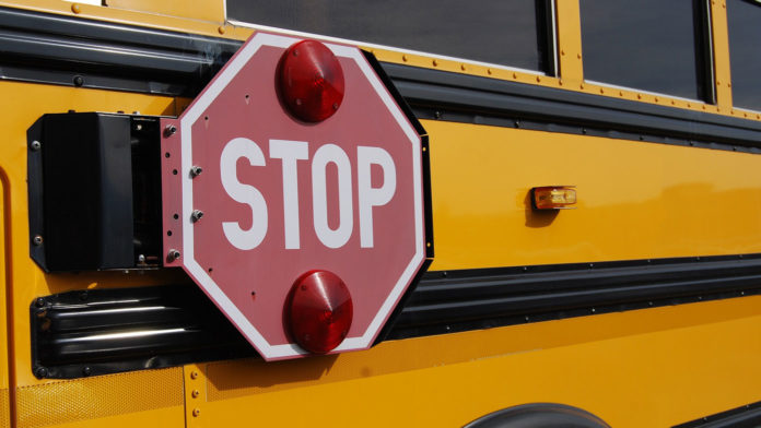 School bus with pop out stop sign