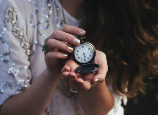woman holding pocketwatch
