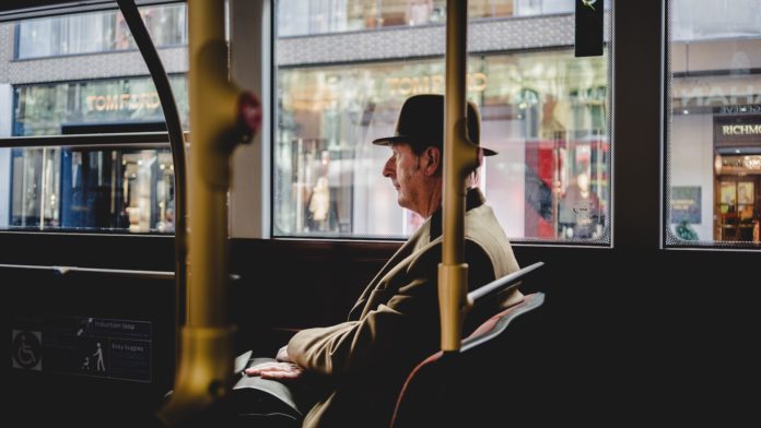 Man with hat on transport