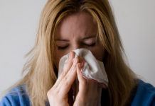 sneezing into tissue