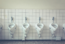 A row of urinals in a public bathroom.