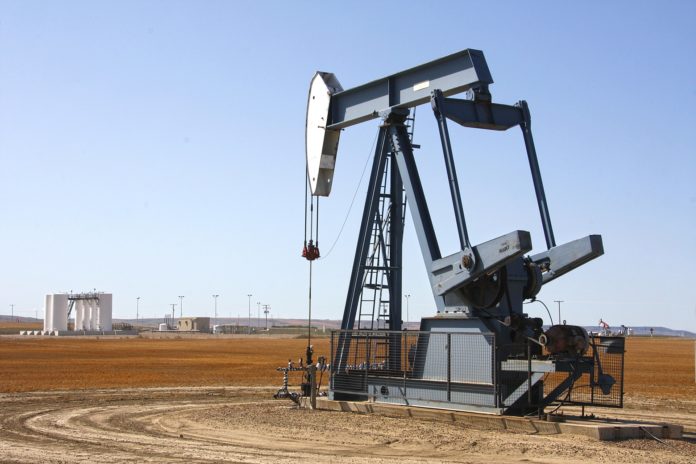 An oil rig in the prairies.