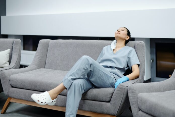 A nurse resting in a hospital break room.