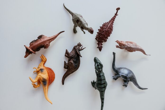 A collection of plastic dinosaur toys.